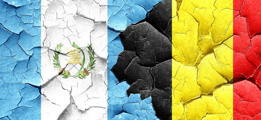 guatemala flag with Belgium flag on a grunge cracked wall