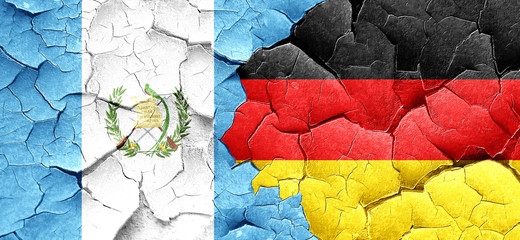 guatemala flag with Germany flag on a grunge cracked wall