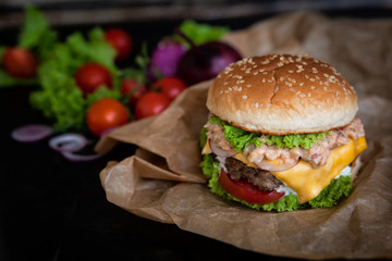 Home made burger with fresh vegetables. Fastfood meal