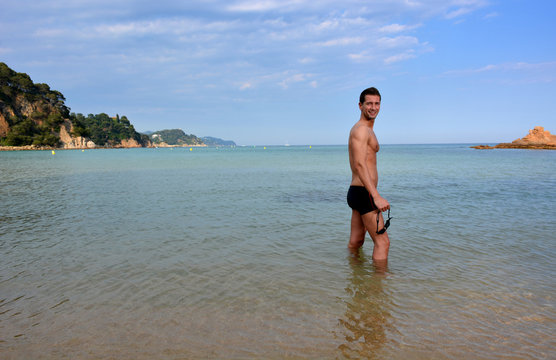 swimmer training on the beach