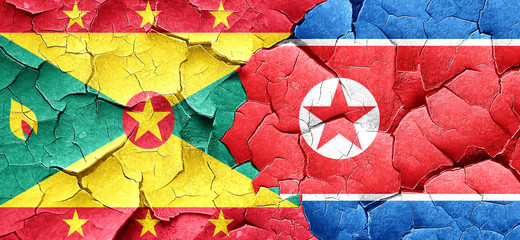 Grenada flag with North Korea flag on a grunge cracked wall