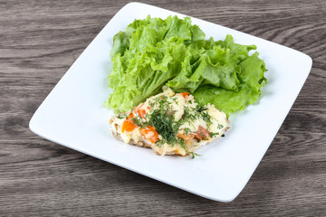 Meat covered cheese and tomato