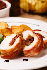 Delicious chicken rolls with dried tomatoes and mozzarella.