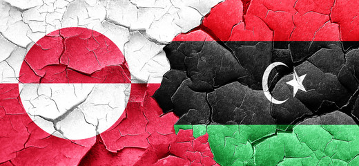 greenland flag with Libya flag on a grunge cracked wall