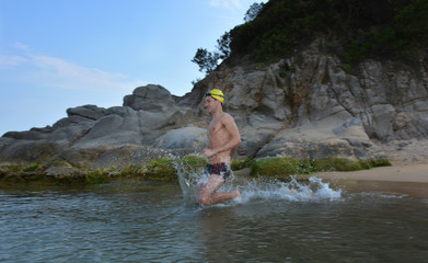 Fototapeta na wymiar swimmer training on the beach