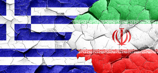 Greece flag with Iran flag on a grunge cracked wall