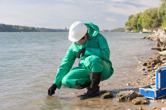 Pollution control inspector filling up sample container
