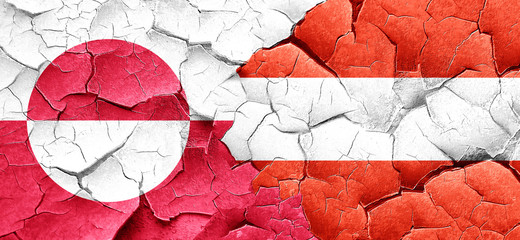 greenland flag with Austria flag on a grunge cracked wall © Argus