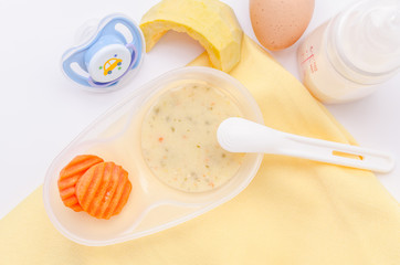 Fresh, various kinds of baby food in plastic bowls. Shot for a s