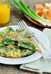 Scrambled eggs with parsley, dill, coriander and green onions. Breakfast.