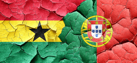Ghana flag with Portugal flag on a grunge cracked wall
