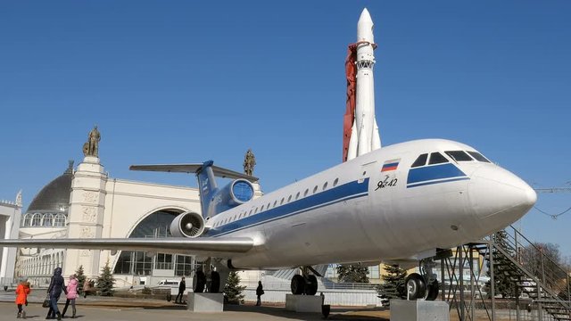 MOSCOW, RUSSIA - MAR 15, 2016: people are walking on VDNKh, plane and rocket