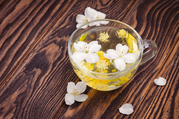 Obraz na płótnie Canvas Cup of tea with jasmine and linden flower