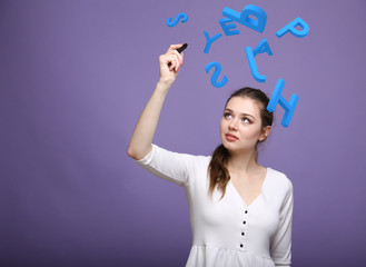 Woman working with a set of letters, writing concept.
