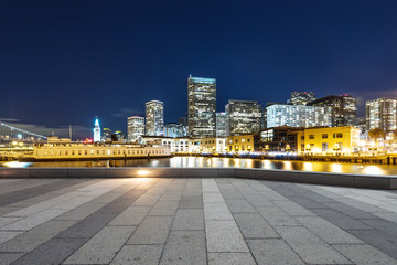 empty floor with modern buildings near water in san francisco
