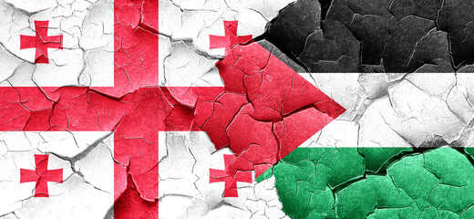 Georgia flag with Palestine flag on a grunge cracked wall