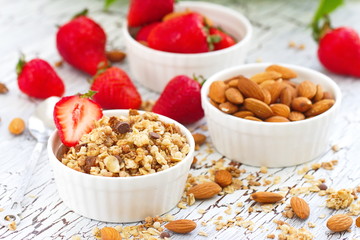 Oat granola with almond, chocolate and fresh strawberry