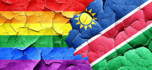 Fototapeta premium Gay pride flag with Namibia flag on a grunge cracked wall
