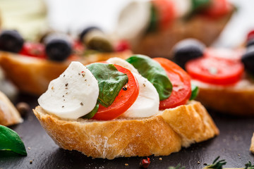 Bruschetta with tomatoes, mozzarella and basil