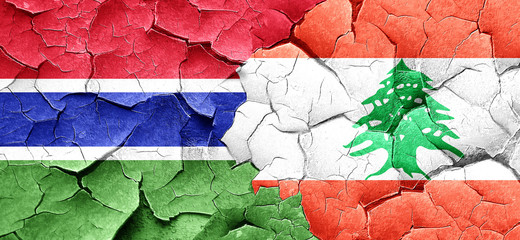 Gambia flag with Lebanon flag on a grunge cracked wall