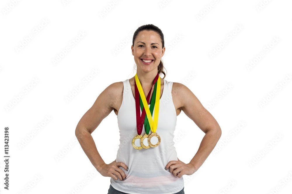 Wall mural Athlete posing with gold medals around his neck