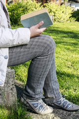 Woman reading book in the garden