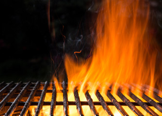 Empty BBQ Flaming Charcoal Cast Iron grill.