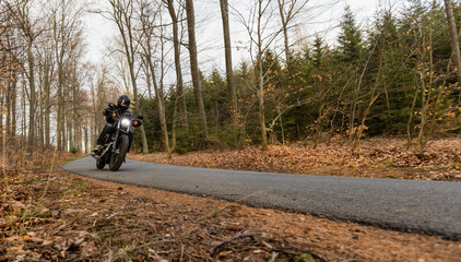 Obraz premium Man seat on the motorcycle on the road.