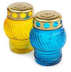 Blue and yellow cemetery candles isolated