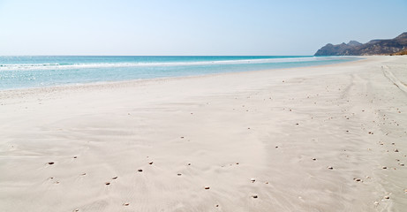 Fototapeta na wymiar in oman coastline sea ocean gulf rock and beach relax near sky