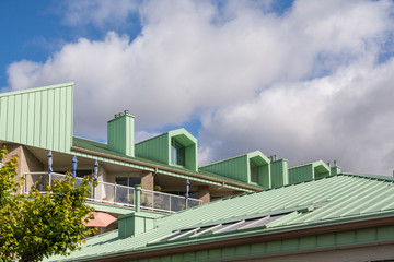 Obraz na płótnie Canvas Green Metal Roof on Apartment