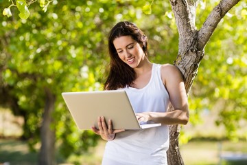 Fototapeta premium Happy woman using laptop