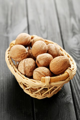 Walnuts on a black wooden table