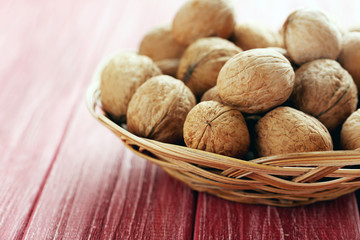 Walnuts on a red wooden table