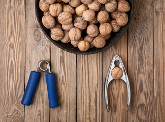Nutcracker and carpal expander and nuts