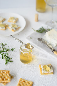 Homemade herb and white sweet wine  jelly to pair with crackers and blue cheese. Selective focus