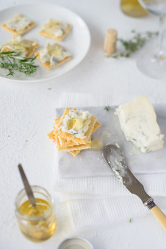 Crackers with gorgonzola and herb and white wine  jelly. Selective focus