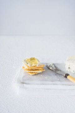 Crackers with gorgonzola and herb and white sweet wine  jelly. Selective focus