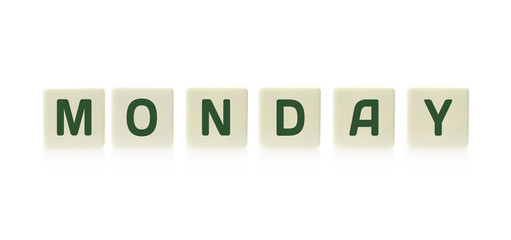 Word "Monday" on board game square plastic tile pieces, isolated on a white background.