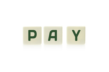 Word "Pay" on board game square plastic tile pieces, isolated on a white background.