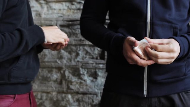 addict buying dose from drug dealer on street 9