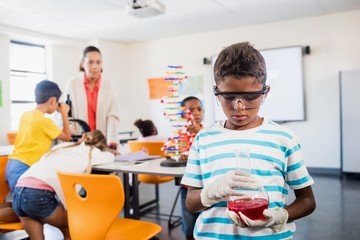 Pupil looking at beaker