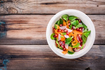 Salad with corn lettuce, radish, carrot, pomegranate and mint