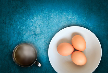 raw eggs with hot chocolate on wooden background, wooden with blank space for insert your texts or products.