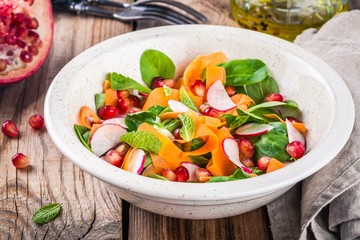 Salad with corn lettuce, radish, carrot, pomegranate and mint