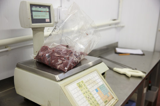 Weighing Meat In Butchers Cold Store
