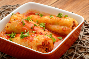 Stuffed peppers baked with tomato sauce.