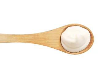 Papier Peint photo Produits laitiers White cream on a wooden spoon