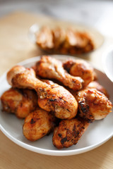 Grilled spiced thai chicken drumsticks on a plate