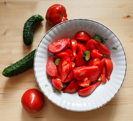 Tomato salad with pickles in a bowl